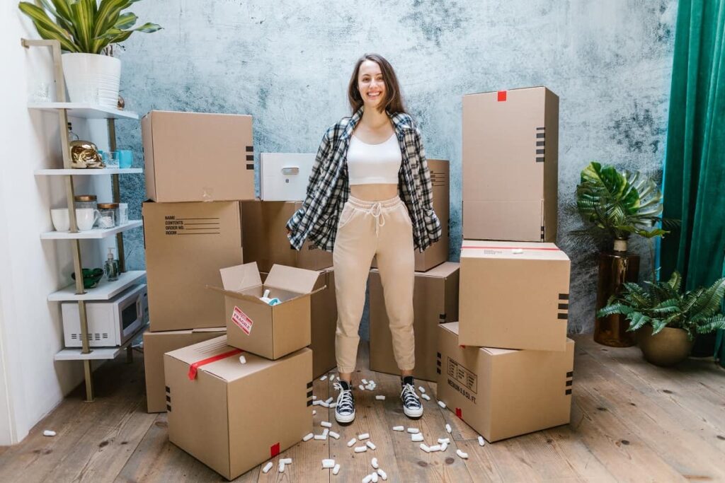 a woman next to boxes